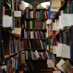 books on brown wooden shelf